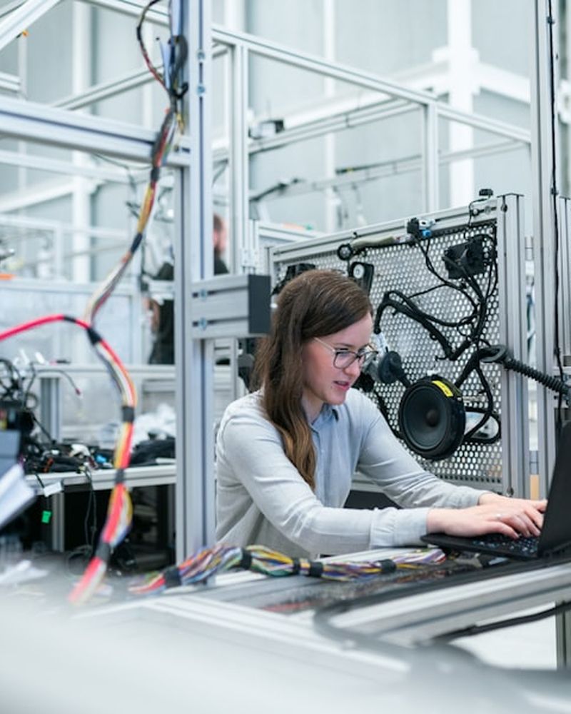 Engineer working on an industrial robotic production line