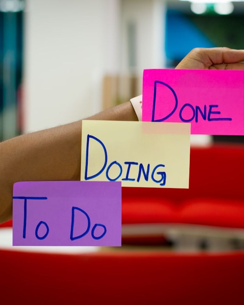 To do, doing and done sticky notes on a board