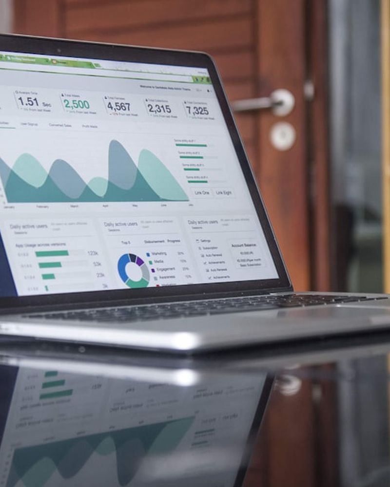 Business reports open on a laptop